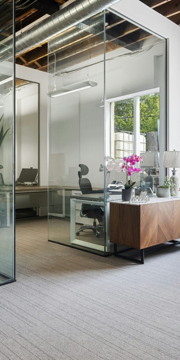 Desks and a glass partition in a small office